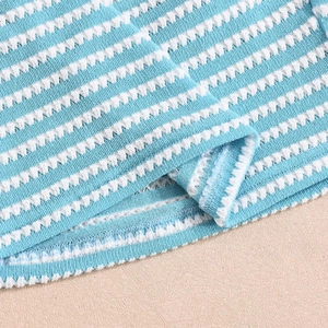 Detail of blue and white horizontal striped knitted fabric showing soft breathable texture