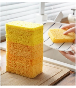 Detailed porous texture of yellow and orange wood pulp sponge for efficient dish cleaning