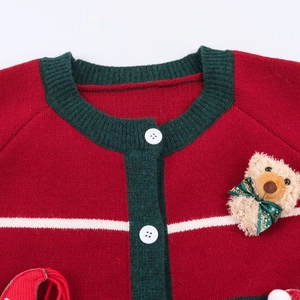 Red Christmas knit cardigan featuring green trim, white buttons, and a plush bear ornament
