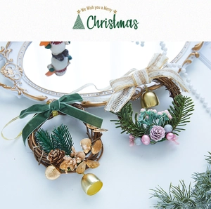 Close-up of Christmas wreaths with velvet bows and bells on a white vintage background