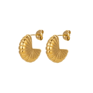 Macro detail of golden fan-shaped earrings with elegant metallic 3D shell texture