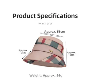Detail of pink cloche sun hat with plaid ribbon, gold metal logo, and size measurements