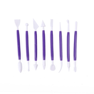 Detailed set of 8 purple clay carving tools with diverse white shaping heads on white background