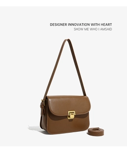 Sac à bandoulière marron vintage pour femme, élégant sac porté épaule en cuir avec fermoir doré.