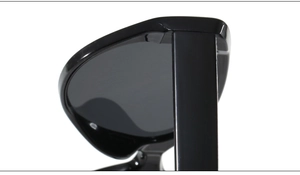 Macro view of the hinge and glossy black acetate frame finish on these cat eye sunglasses
