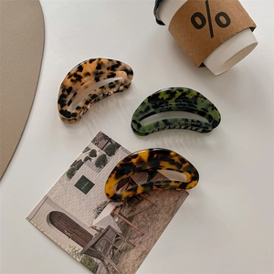 Oversized acetate claw clips with leopard and tortoise patterns in three elegant colors