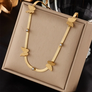 Golden snake chain necklace with frosted butterfly pendants and sparkling rhinestones