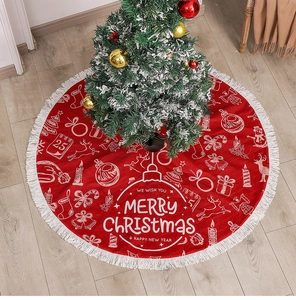 Detail of red Christmas tree skirt with white tassels and Merry Christmas print