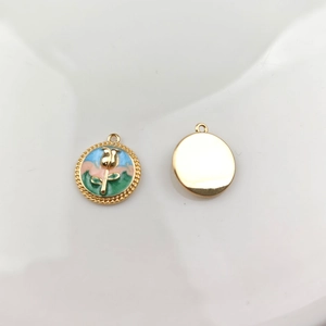 Detail of oil painting style rose enamel pendant and golden polished metal back