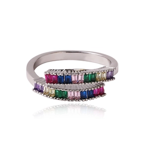 Detail of crossover ring featuring colorful emerald-cut zircons set in polished silver metal