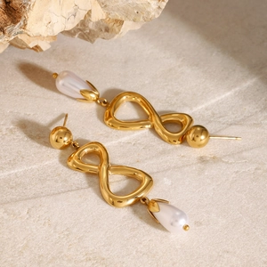 Boucles d'oreilles pendantes infini et perles sur pierre pour un style luxueux