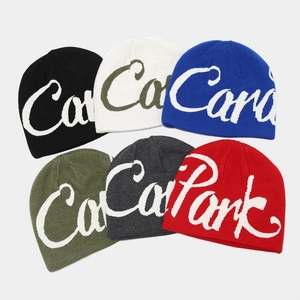 Streetwear knitted beanies with jacquard letters in black, blue, and red colors