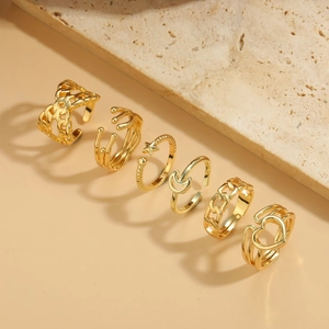 Set of 6 gold adjustable rings with heart, star, moon, and chain designs on stone base