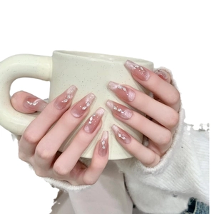Handmade long coffin press-on nails with nude pink gradient, silver glitter, and rhinestones
