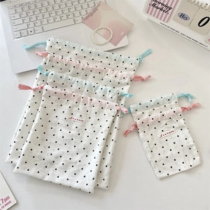 Three-piece set of cute polka dot drawstring storage bags for cosmetics and travel items