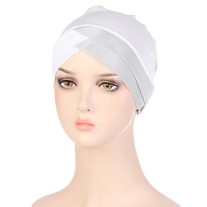 Front view of white stretch turban with silver criss-cross knot on a mannequin head