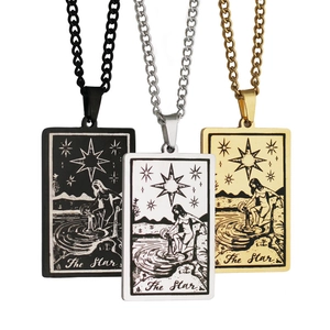 Detailed view of The Star tarot necklaces in black, silver, and gold stainless steel finishes