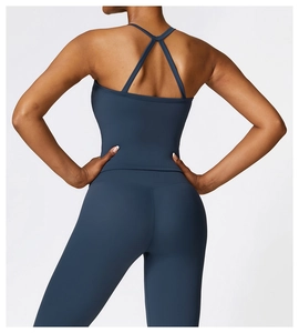 Detail of dusk blue yoga set showing criss-cross back straps and brushed matte texture