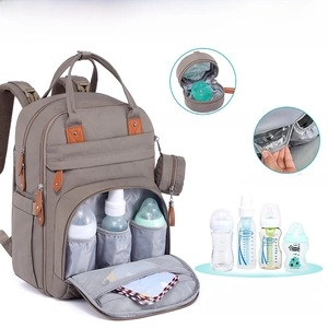 Detail of insulated pockets for 8-11oz bottles and waterproof grey mommy backpack