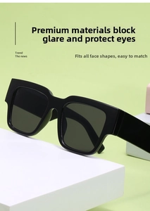 Detail of rectangular wide-temple sunglasses with black frame and dark lenses