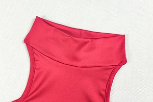 Close-up of bright red stand collar and fine stitching on sleeveless ruffled mini dress