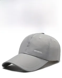 Close-up of a dark grey breathable baseball cap featuring white SPORTS text on the side