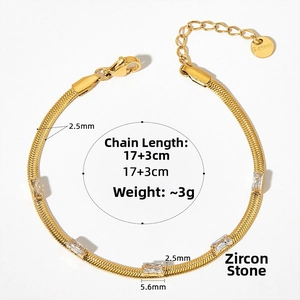 Macro view of gold-plated snake chain bracelet with zircon stones and lobster clasp