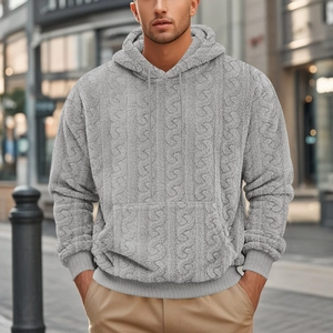 Detail of grey teddy fleece hoodie featuring textured cable knit pattern and cozy fabric