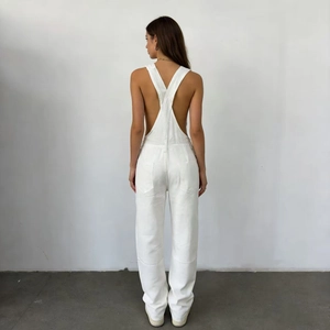Rear view of white denim overalls featuring a unique hollow back design for women