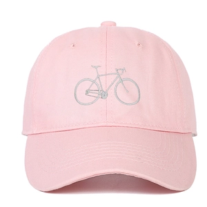 Pink cotton baseball cap featuring light grey bicycle embroidery and curved brim