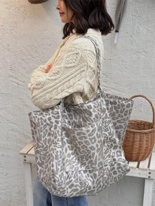 Fashionable leopard print canvas tote bag for women with large capacity shown on a model