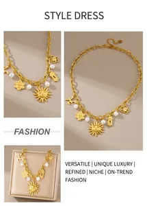 Detail of gold-plated sun flower pendants and white pearls on thick circular link chain