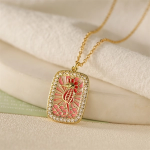 Gold tarot-style necklace featuring a red enamel seahorse pendant with cubic zirconia