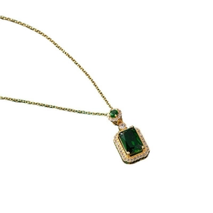 Elegant emerald-cut green gemstone necklace with gold halo setting for women