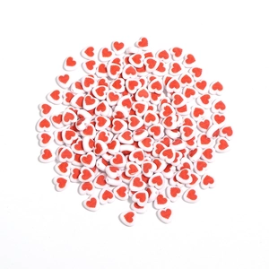 Detailed view of 8mm white heart-shaped acrylic beads with red stripes for DIY jewelry