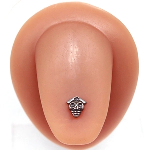 Skull nurse tongue ring in vintage silver finish shown on a realistic tongue model