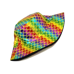 Detail of colorful metallic fish scale pattern and black edge on reversible bucket hat