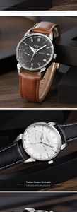 Macro detail of YAZOLE quartz watches showing brown leather strap and roman numeral dial