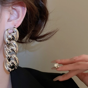 Polished silver chunky chain link earrings shown on model for elegant style
