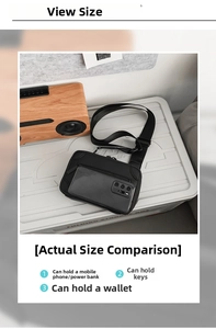 Detailed top view of a black crossbody box bag showing capacity for phone and essentials