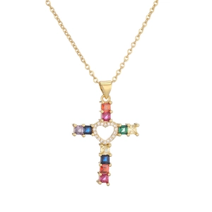 Gold cross necklace featuring colorful gemstones and a hollow heart center on white background