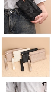 Detail von gewebten Stroh-Clutch-Taschen mit Doppel-Reißverschluss und Handgelenkschlaufen