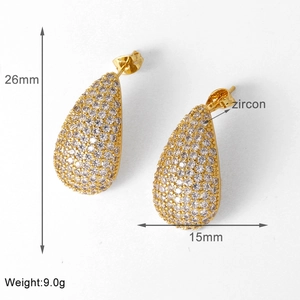 Detail view of teardrop gold earrings with cubic zirconia, dimensions 26mm by 15mm