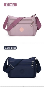 Pink and navy blue nylon crossbody bags with multiple zipper pockets and wide straps