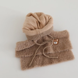 Detail of plush faux mink kids hood with bear patch and soft winter scarf set
