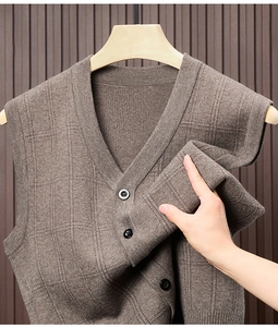 Detail of coffee brown V-neck knit vest showing fine textured weave and button closures