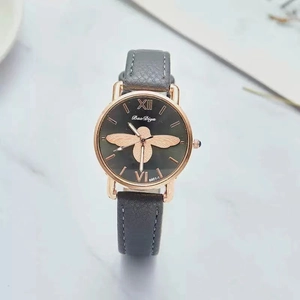 Detailed top view of a luxury watch with golden bee motif on dark grey dial and leather strap