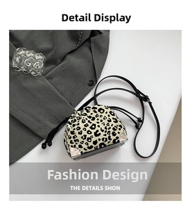 Detail shot of leopard print drawstring bucket bag with silver metal corner protectors