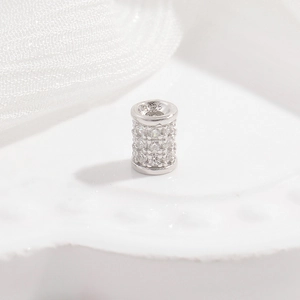 Macro view of S925 sterling silver barrel bead with three rows of micro-pave zircons