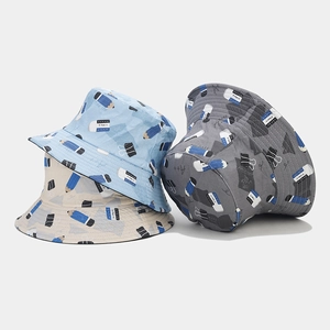 Cotton bucket hats in blue, beige, and grey with all-over school stationery patterns